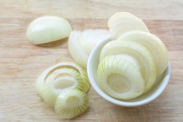 Fototapeta na wymiar onions on a wooden floor