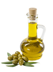 Glass bottle of premium olive oil and some olives with a branch isolated on white background
