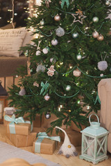Christmas tree with hanging toys in the form of a cookie man