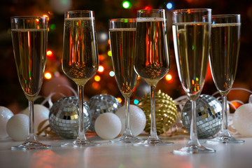 Glasses of champagne and christmas balls