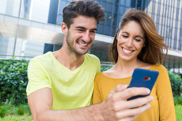 Caucasian couple use of the smart phone