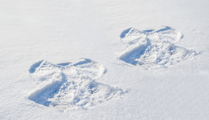 Fototapeta na wymiar Two figures in the snow angel