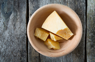 Parmesan cheese in a wooden bowl
