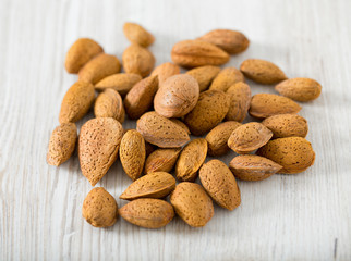 almonds on wooden surface