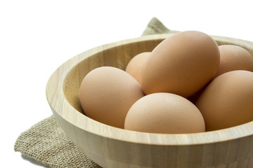Eggs in wooden bowl