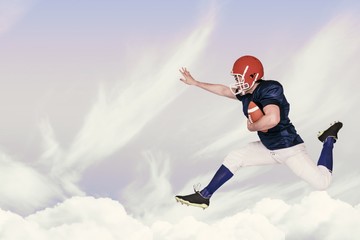 American football player jumping with the ball © vectorfusionart