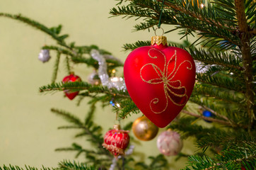 Fototapeta premium Beautiful colorful christmas decorations hanging on christmas tr