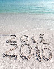 New 2016. The wave washes off an inscription 2015...