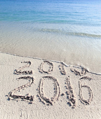 New 2016. The wave washes off an inscription 2015...