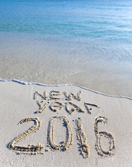 On sand at ocean edge it is written 