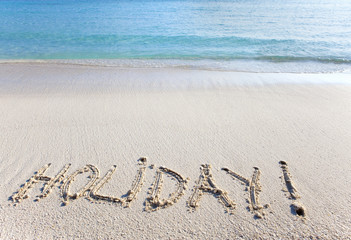 On sand at ocean edge it is written 