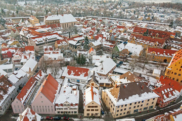 Fototapeta na wymiar Winter panorama of medieval town within fortified wall. Top view from 