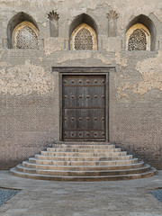 Fototapeta premium One of the doors of the front courtyard of Ibn Tulun Mosque, the largest mosque in Cairo, Egypt. and may be the oldest mosque in the city with its original form