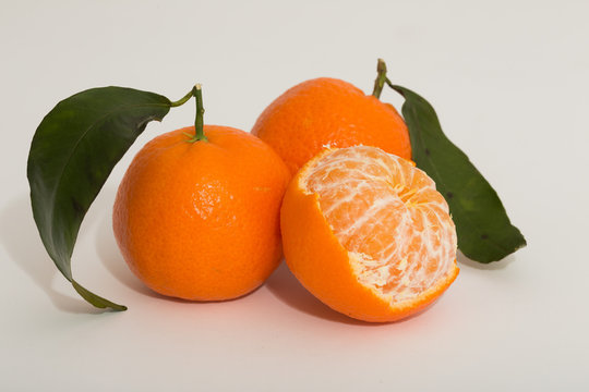 Ripe mandarin citrus on white background