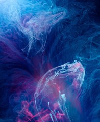 Smoky blue and pink ink in motion on water isolated on black