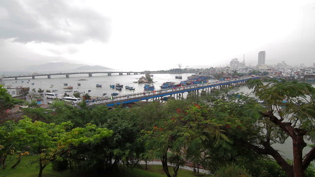 People and vehicles on main bridge in Nha Trang