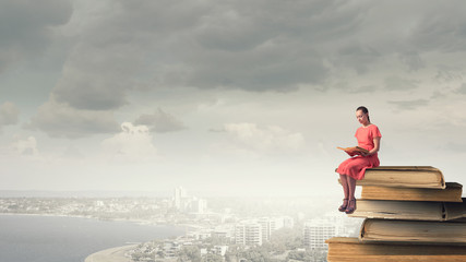 Woman in dress with book