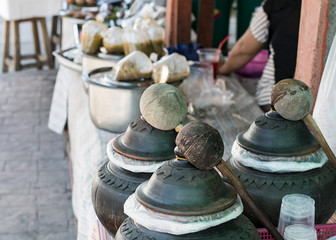 street selling food cooked in pots in Thailand