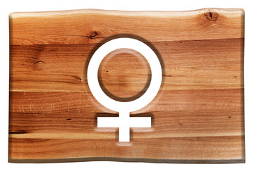Female symbol cut in wooden board isolated on white.