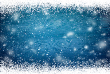 Winter background with flying snowflakes