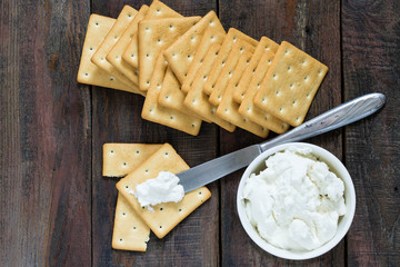 Saltine crackers and ricotta
