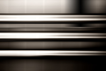 Abstrakte Rohre / Drei abstrakte parallel montierte Edelstahlrohre an einer verwischten Wand