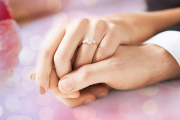 close up of couple hands with engagement ring - obrazy, fototapety, plakaty