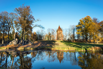 Fototapeta na wymiar Autumn landscape with an old tower