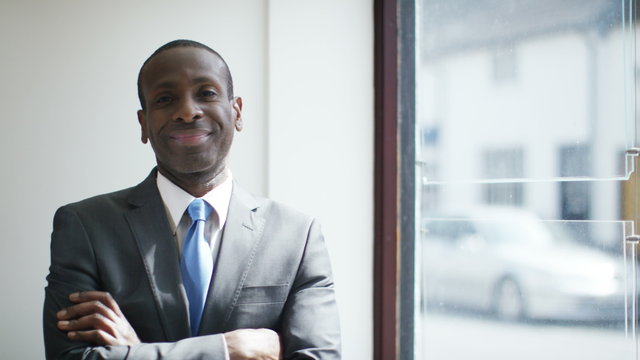  Portrait of happy successful african american businessman