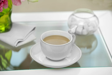 Cup of coffee on table close up