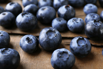 Fresh blueberries on wooden table, closeup