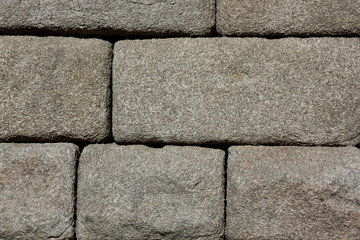 Granite blocks of ancient Roman aqueduct in Segovia, Spain

