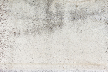 Worn grey cement stone wall