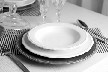 Table set at restaurant on light background