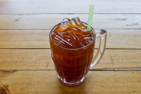 Thai Ice Tea with green straw