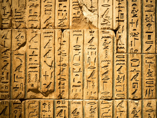 Ancient egyptian hieroglyph carved in sandstone - obrazy, fototapety, plakaty