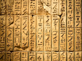 Deurstickers Ancient egyptian hieroglyph carved in sandstone © kmiragaya