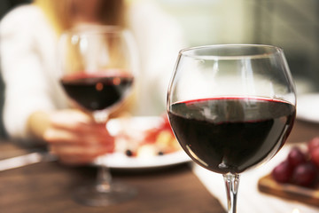 Glass with red wine on the table