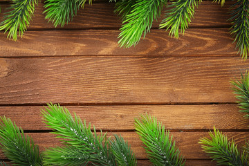 Christmas fir tree branches on wooden table