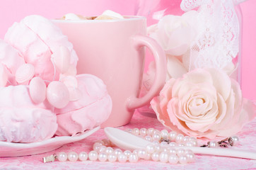 Cute set of pink princess accessories and sweets. Bottle with mastic flowers, big peach rose, zefir, cup of cacao with marshmellow, little spoon and pearl jewerly.