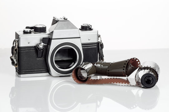 Vintage camera with a 35mm film on a white background