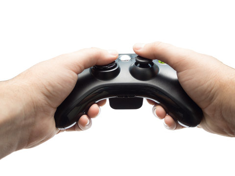 Male Hands Holding Gamepad isolated