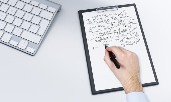 notepad and pen, keyboard, worklpace
