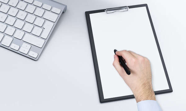 notepad and pen, keyboard, worklpace