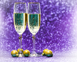 Two glasses of champagne with lights in the background