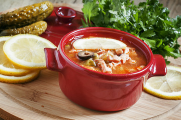 Soljanka in red small saucepan, selective focus