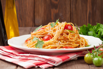 Spaghetti pasta with tomatoes and parsley