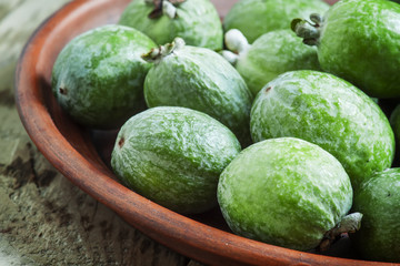 Feijoa on a plate, selective focus