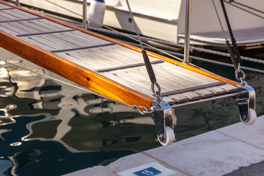 wooden ladder on marine yacht staying in port