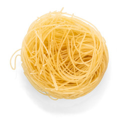 Spaghetti in nest close up on white